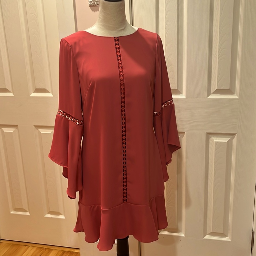 Bell sleeve, soft dress with cut outs and ruffled hem